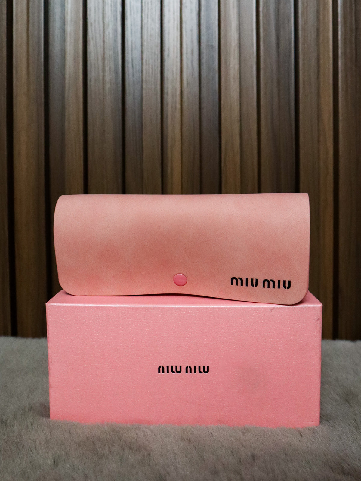 MIU MIU Occhiali sole geometrici irregolari rosa