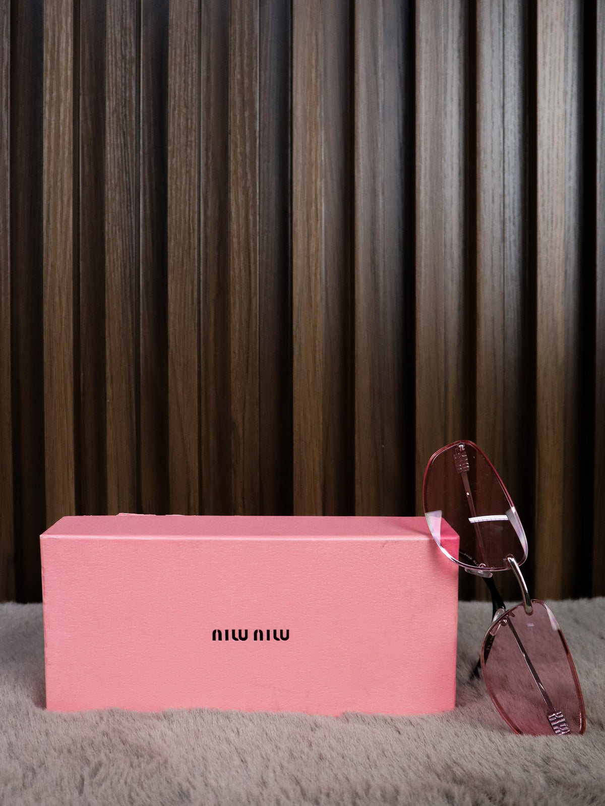 MIU MIU Occhiali sole geometrici irregolari rosa