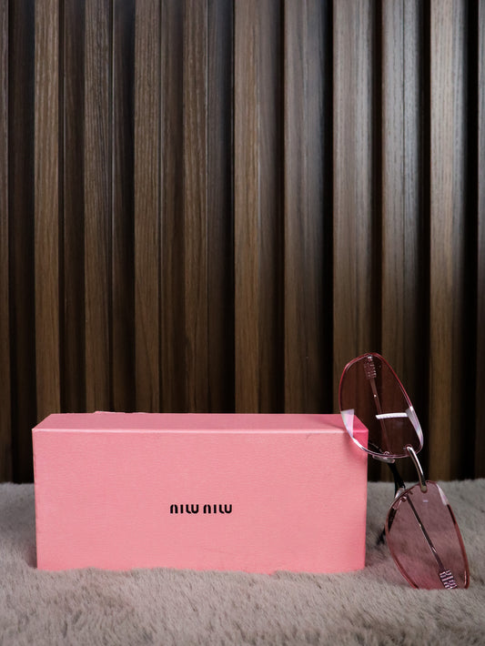 MIU MIU Occhiali sole geometrici irregolari rosa