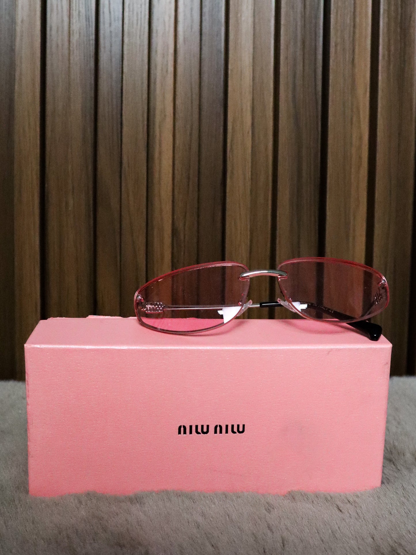 MIU MIU Occhiali sole geometrici irregolari rosa