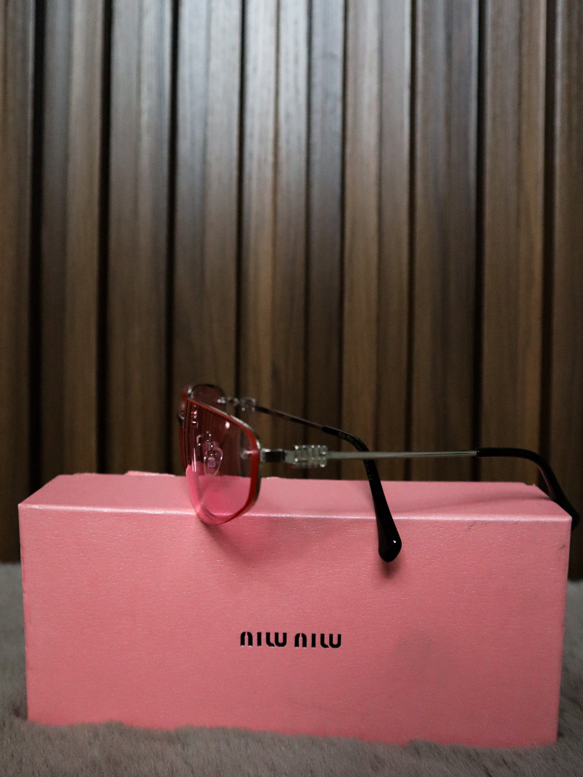 MIU MIU Occhiali sole geometrici irregolari rosa
