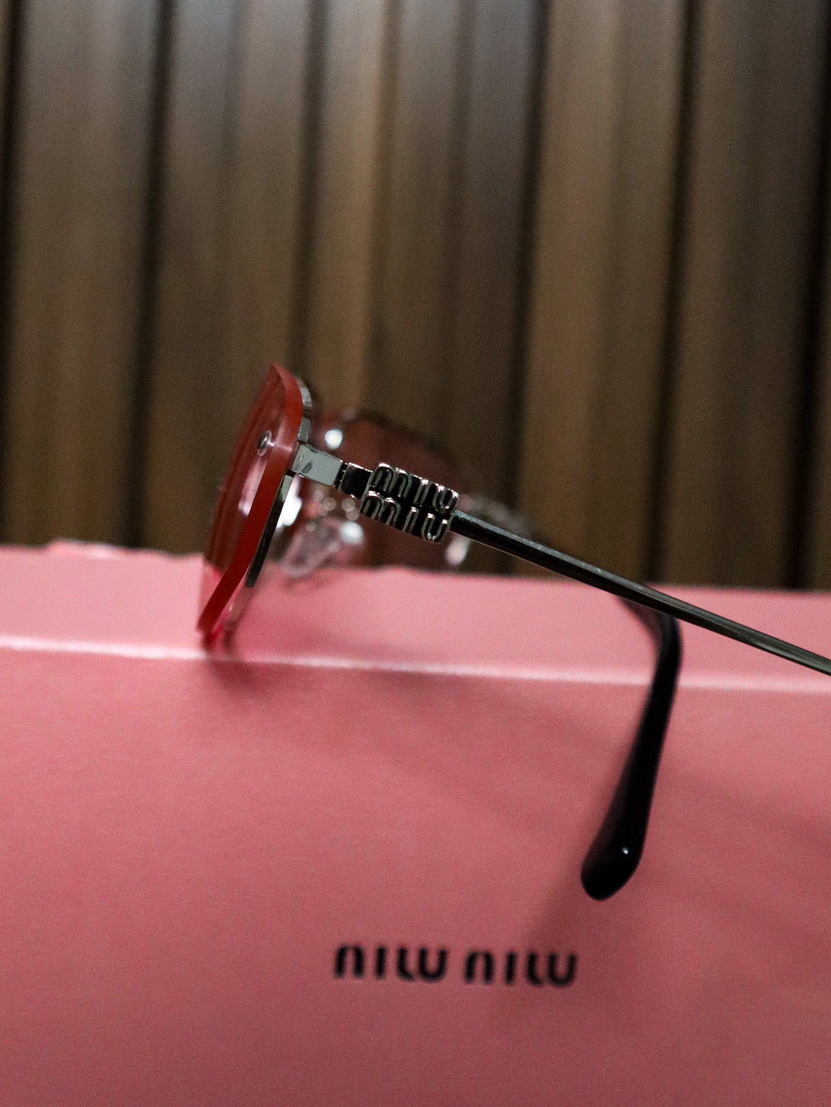 MIU MIU Occhiali sole geometrici irregolari rosa